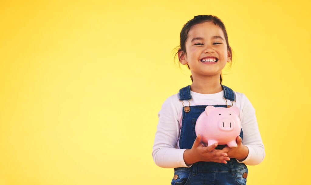 Girl,Child,,Piggy,Bank,And,Saving,In,Studio,Portrait,With